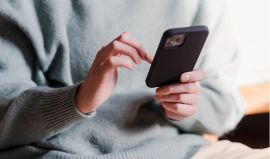 Man using phone, for page: Romsey's local provider for Energy Assessment Solutions